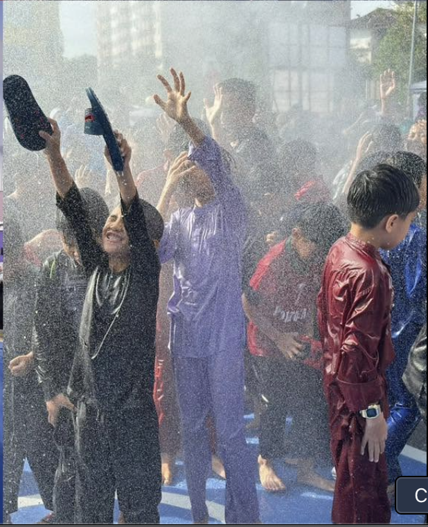 Children enjoying a celebratory water spray at the BSP carnival in 2025